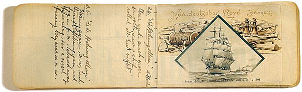 A photograph of a small leatherbound diary, filled with neat writing in pen.