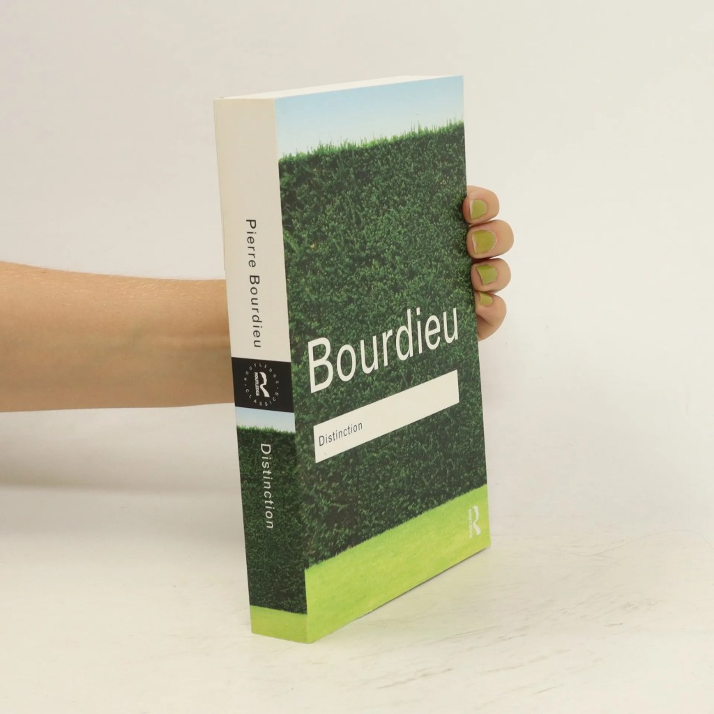 A person holding the book 'Distinction' by Pierre Bourdieu, featuring a green grass cover with title and author's name visible.